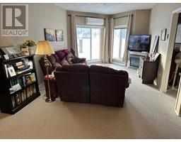 Living room - 104 9810 94 Street, Peace River, AB T8S0A1 Photo 2