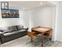 Living room - 30 Huron St, Toronto, ON M5T2A3 Photo 4