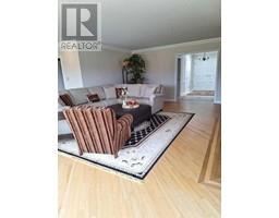 Family room - 100 A 17177 306 Avenue E, Rural Foothills County, AB T1S1A2 Photo 7