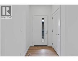 Living room - 1102 201 Cooperswood Green Sw, Airdrie, AB T3B3Y6 Photo 4