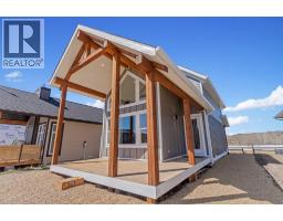 Den - 48 Cottageclub Lane, Rural Rocky View County, AB T4C1B1 Photo 3