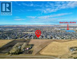 Family room - 1880 Thornbird Road Se, Airdrie, AB T4A2E3 Photo 4