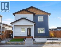 Living room - 212 Neecheah Street, Whitehorse,  Y1A5G9 Photo 2
