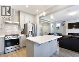 Living room - 158 Osborne Common Sw, Airdrie, AB T4B5G7 Photo 3