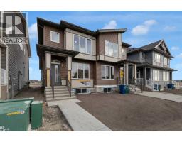 Living room - 2022 Cobblebrook Crescent Sw, Airdrie, AB T4B5X1 Photo 2