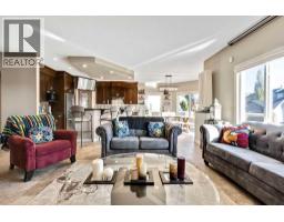 Living room - 30 Drake Landing Road, Okotoks, AB T1S2M2 Photo 2