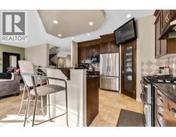 Family room - 30 Drake Landing Road, Okotoks, AB T1S2M2 Photo 5