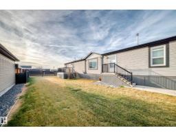 Family room - 115 Hawthorn Dr, Morinville, AB T8R2P7 Photo 4