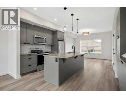 Kitchen - 1206 525 River Heights Drive, Cochrane, AB T4C3E3 Photo 3