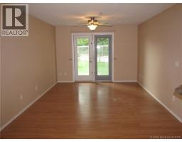Living room - 108 5205 Woodland Road, Innisfail, AB T4G0B2 Photo 2