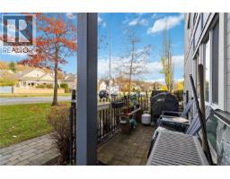 Living room - 105 4050 Douglas St, Saanich, BC V8X0A5 Photo 2