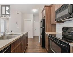 Den - 9314 101 Sunset Drive, Cochrane, AB T4C0W7 Photo 2