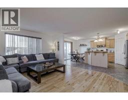 Living room - 212 Cove Court, Chestermere, AB T1X1L5 Photo 2