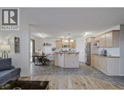 Dining room - 212 Cove Court, Chestermere, AB T1X1L5 Photo 3