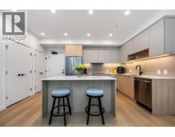 Living room - 411 3564 A Ryder Hesjedal Way, Colwood, BC V9C0V3 Photo 2