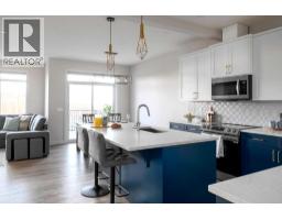 Dining room - 87 Waterford Mews, Chestermere, AB T1X3B7 Photo 3