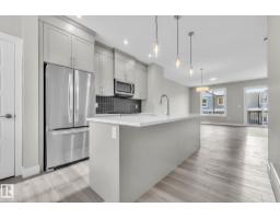 Kitchen - 7 6905 25 Av Sw, Edmonton, AB T6X3B7 Photo 3