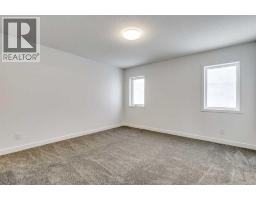 Den - 1123 Fowler Road Sw, Airdrie, AB T4B3M9 Photo 2