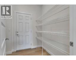 Kitchen - 1489 Bayview Point Sw, Airdrie, AB T4B5K1 Photo 4