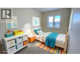 Bedroom - 2 106 4 Street Nw, Sundre, AB T0M1X0 Photo 2