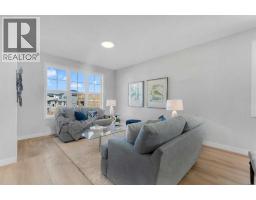 Living room - 1201 Iron Ridge Avenue, Crossfield, AB T0M0S0 Photo 3