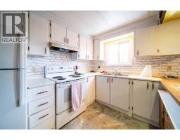 Kitchen - 513 2 Avenuecrescent, Wainwright, AB T9W1A3 Photo 2