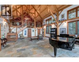 Family room - 10 32376 Highway 760, Rural Mountain View County, AB T0M1X0 Photo 4