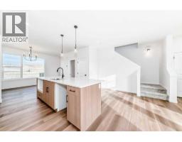 Great room - 406 Heartland Way, Cochrane, AB T4C3E5 Photo 4