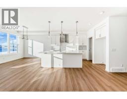 Den - 32 Southborough Common, Cochrane, AB T4C3J7 Photo 5