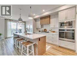 Kitchen - 97 Monarch Bend, Rural Rocky View County, AB T3Z0K4 Photo 3