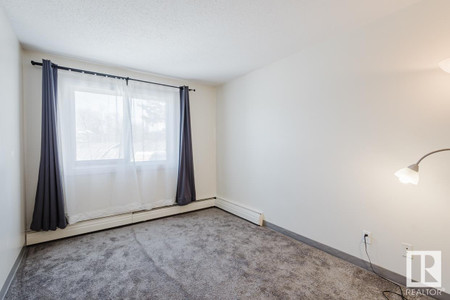 Living room - 226 5125 Riverbend Rd Nw, Edmonton, AB T6H5K5 Photo 1