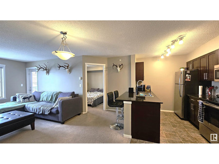 Living room - 409 3207 James Mowatt Tr Sw, Edmonton, AB T6W3L6 Photo 1