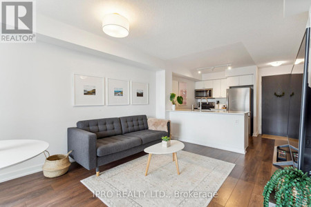 Living room - 702 8 Trent Ave, Toronto, ON M4C0A6 Photo 1